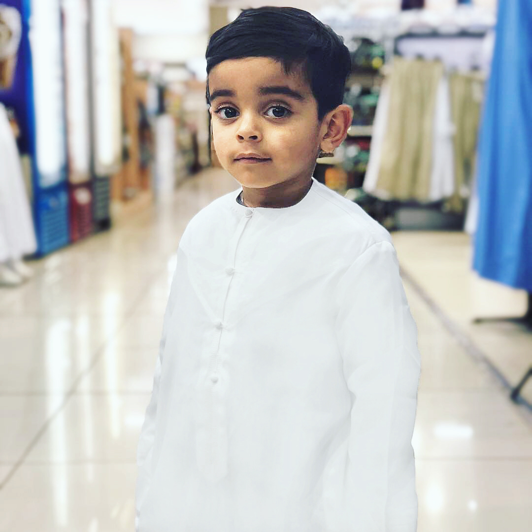 Traditional all-white custom qamis for kids. A timeless, tailored look for boys created through the al qamees Design Your Own tool.