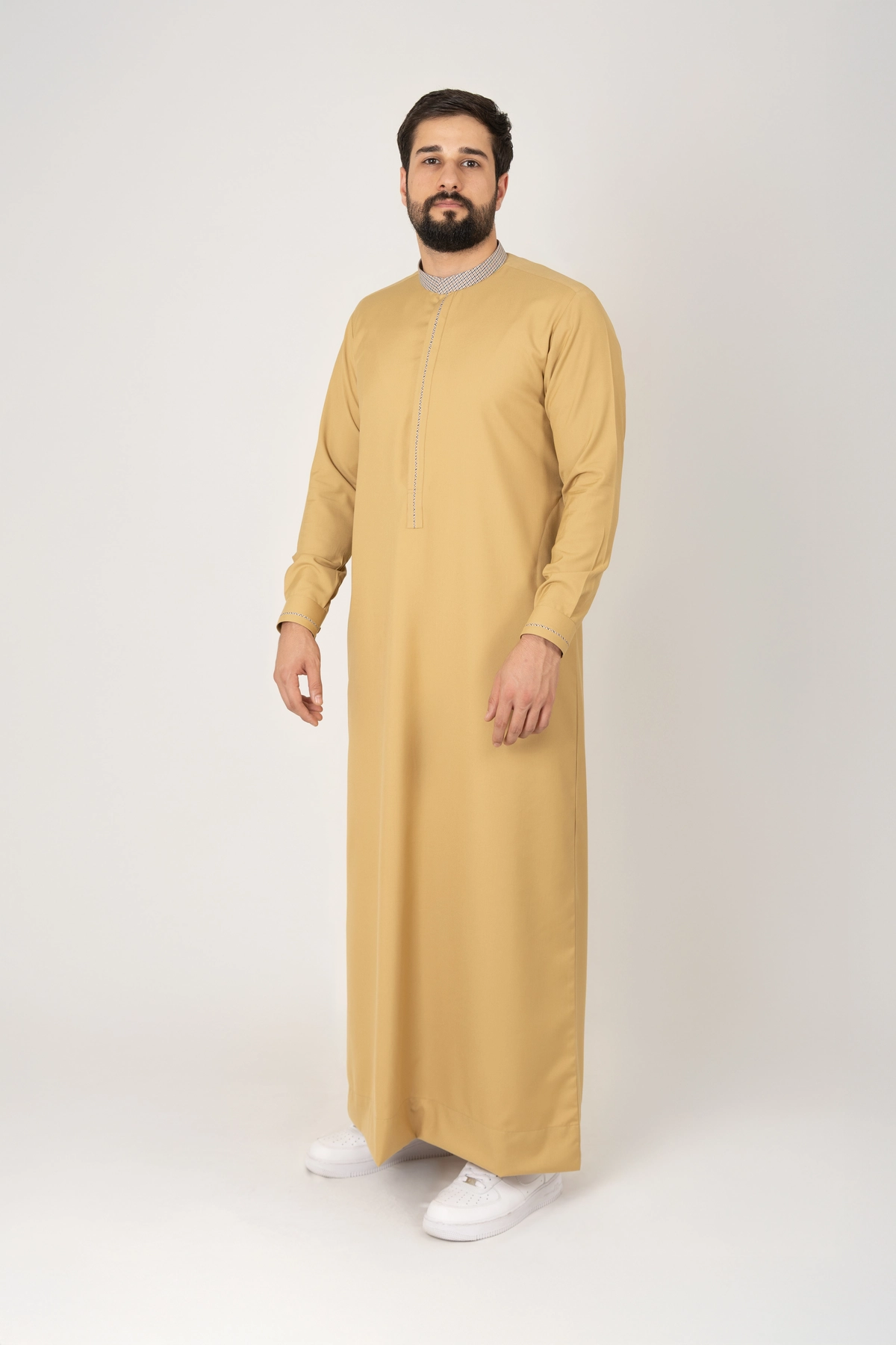 C-XC-160-Guard-2-alqamees-Mustard-thobe-1.webp Men’s mustard yellow thobe with textured collar by alqamees. A ready-to-wear thobe featuring a modern tailored fit, tonal embroidery, and premium fabric, representing the signature craftsmanship of the alqamees collection.