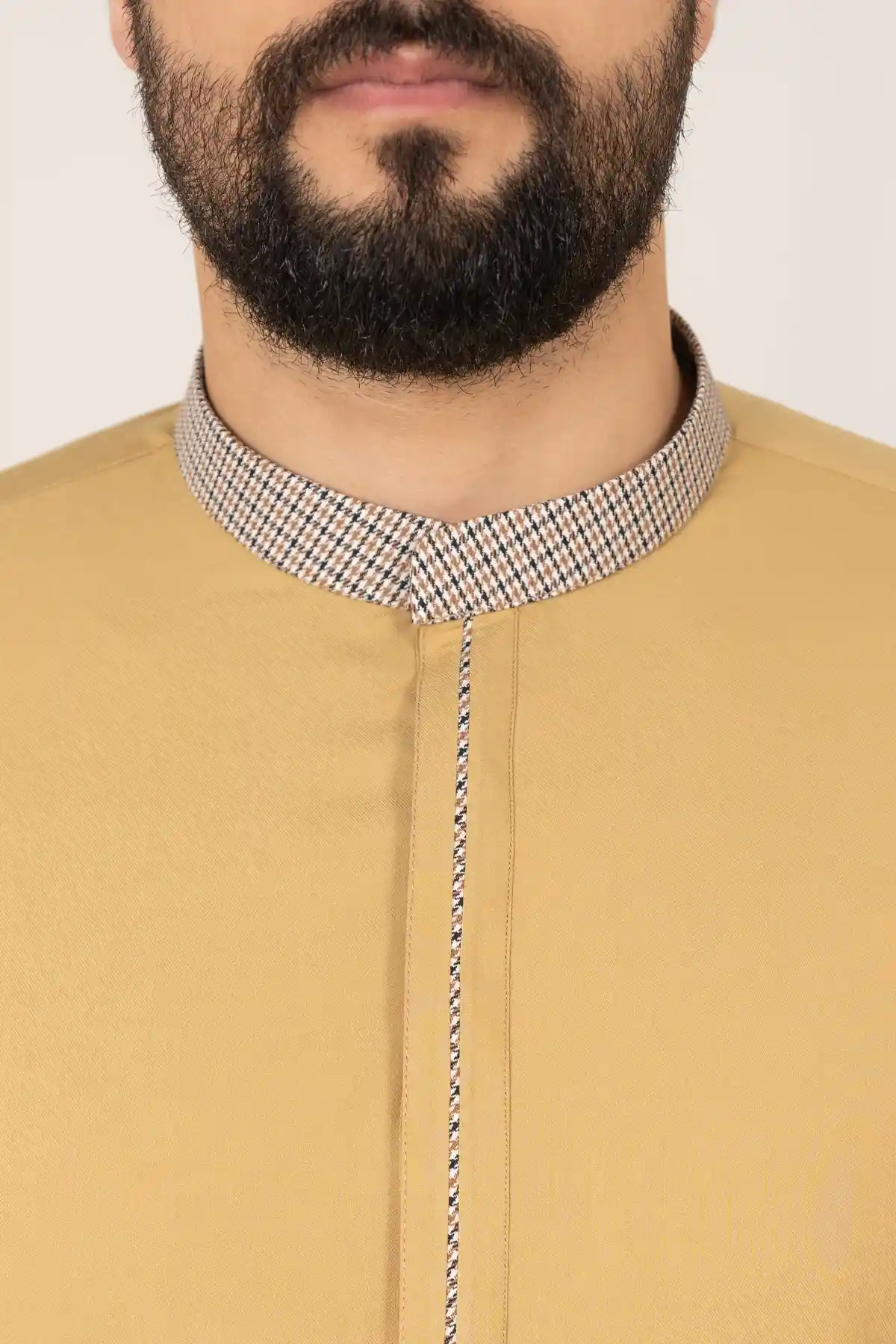 C-XC-160-Guard-5-alqamees-Mustard-thobe-1.webp