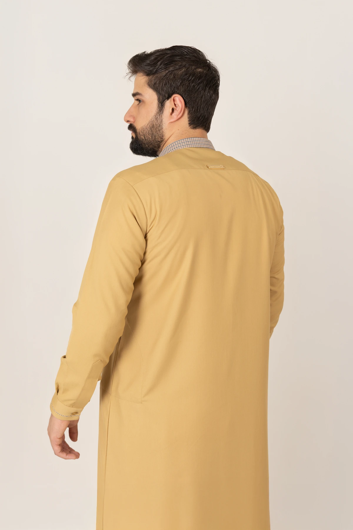 C-XC-160-Guard-7-alqamees-Mustard-thobe-1.webp