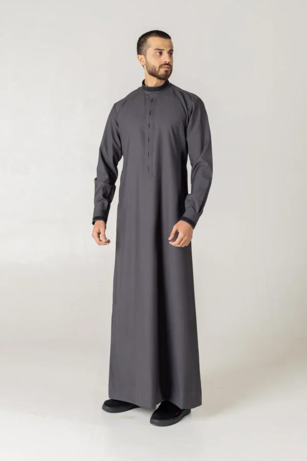 Classic charcoal grey thobe for men by alqamees. A sophisticated, ready-to-wear thobe featuring a modern tailored fit, mandarin collar, and premium fabric, perfect for formal or everyday modest wear.