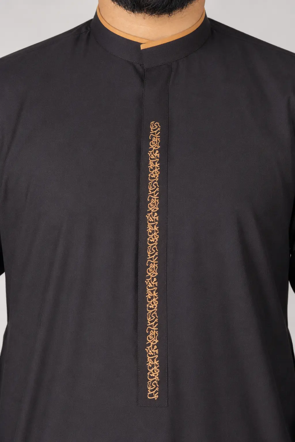 Hawk Black (3) Black kurta with a gold-embroidered vertical placket and orange-trimmed mandarin collar.