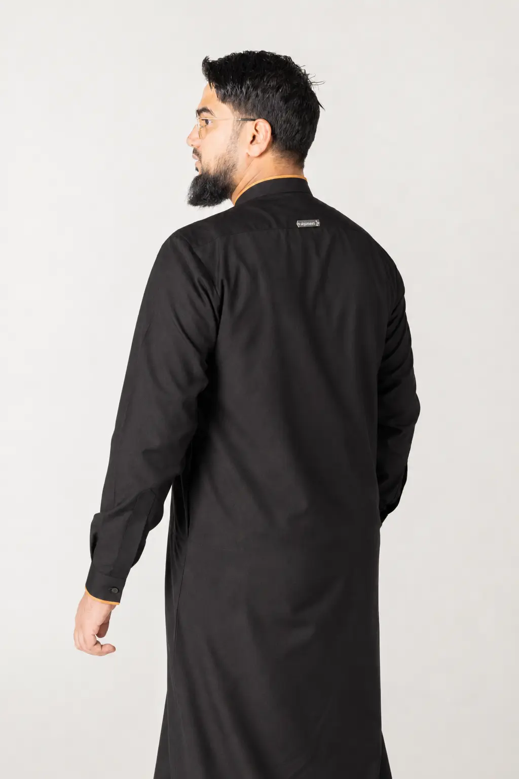 Hawk Black (7) Back view of a man wearing a black long-sleeve kurta, with a small label on the upper back.